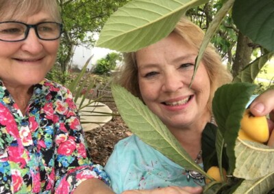 Kate and Virginia with loquats (2020)